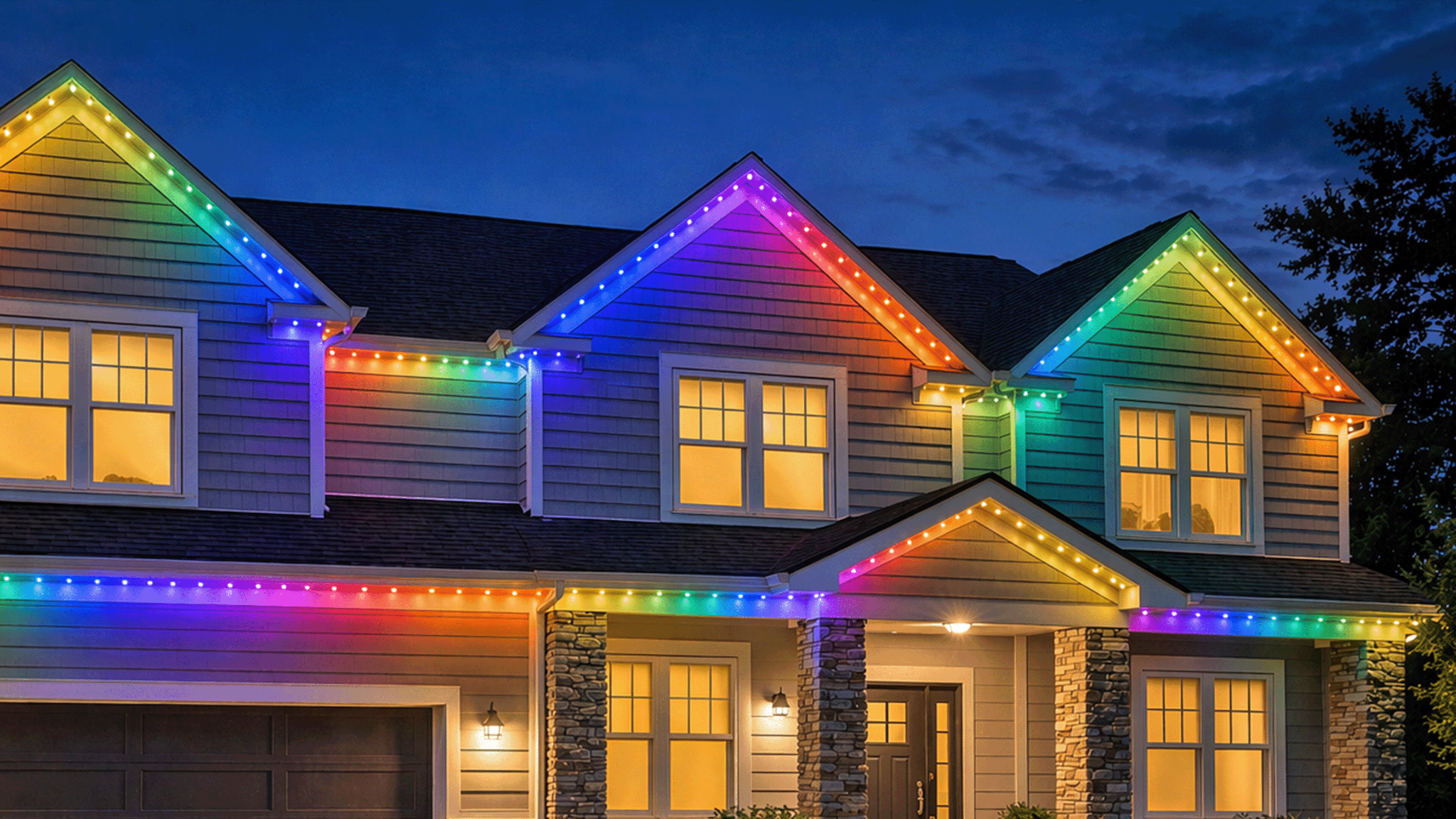 Colorful permanent under-eave lights on a home